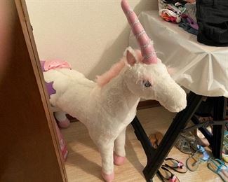 Stuffed Unicorn and Girls Shoes