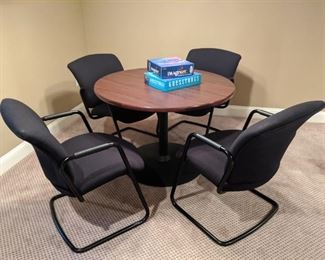 $60   Round office table, four black chairs