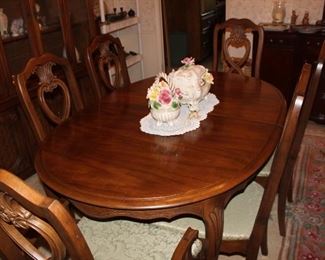 60" plus 18" leaf; two armchairs and four side chairs