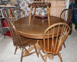 solid oak 48" round plus 20" leaf, five chairs