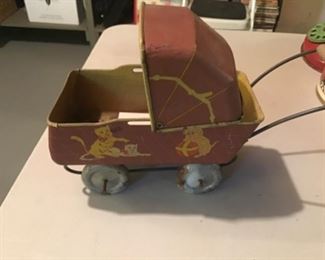 Vintage metal small doll buggy