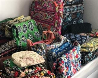 Collection of Vera Bradley purses, accessories and luggage.