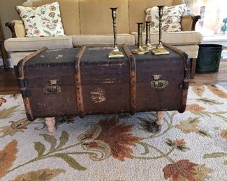 steamer trunk brass candlesticks, velvet sofa, tin oval bucket