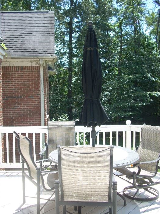 Patio table with 4 chairs and umbrella and stand