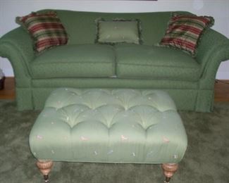 Green love seat and ottoman