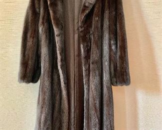 $800 Revillon (Saks Fifth Avenue) three quarter length mink coat. Estimated size L.