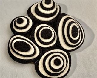 $45 Black and white swirl felt pin. 3.25” x 3”