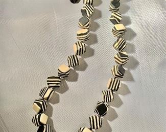 $40 Sylca black and cream polymer clay bead adjustable length necklace. 32”L