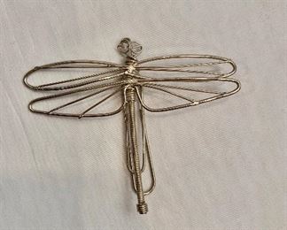 $10 Metal dragonfly with paper clip clasp. 2.5”H x 3.25”W