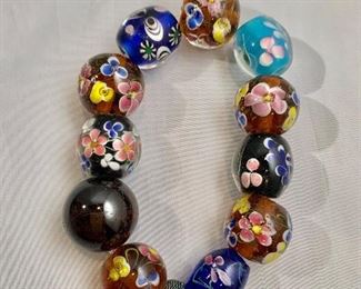$20 Glass beads on elastic cord. 8"-9"L