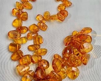 $30 Amber colored polymer necklace. 30"L