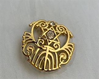 $20 - Michal Porat 2010, signed, gold and silver tone brooch.  2"D.