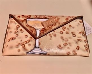 $125 Kent Stetson champagne clutch, signed, new with tags. 10" x 7"