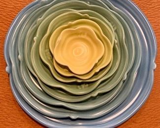 $250 - Set of 8 Marge Margules decorative cabbage design serving plates. Largest plate 12"D, smallest plate 3.25"D
