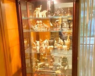 Mahogany lighted curio cabinet