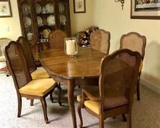 French Provincial dining room table with 6 cane back chairs, Last supper picture and Provincial china cabinet