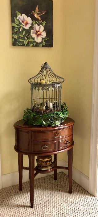 Nice oval side table, bird cage, hummingbird picture