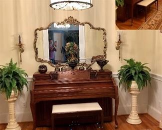 Story & Clark piano, urns with ferns, large gold mirror 