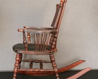 Ornate early 1900's child's rocker possibly Rosewood all original 33 by 32 and a half by 23 and half