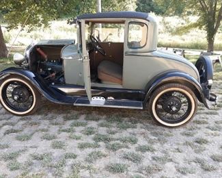 1929 Ford Coupe 4 cycle engine in good condition,has keys but does need some motor work and repair does run
