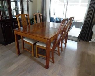Small Dining Set by Broyhill Premier, with 2 leaves and 4 Chairs.  Asian design