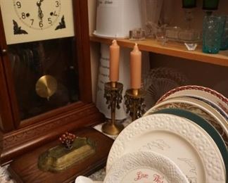 clock, candle holders, plates