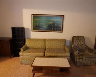 sleeper sofa, coffee table chair, bookcase,  wall decor, cabinet