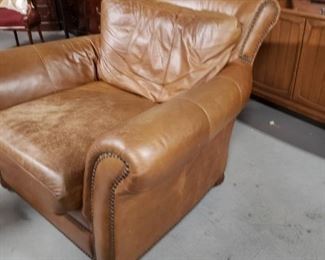 Brown Distressed leather oversized studded arm chair $395