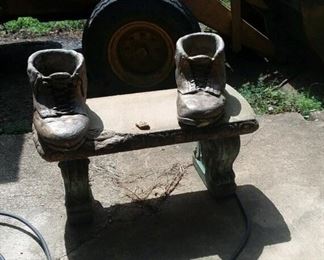 concrete bench with concrete boot planters
