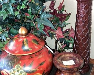 Lidded container with colorful fruit; candle sticks