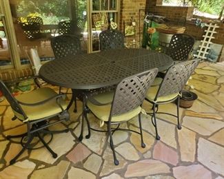 Cast Aluminum Set by Summer Classics 42X84 Oval 2 swivel and 4 side chairs.  pd $2,800.00