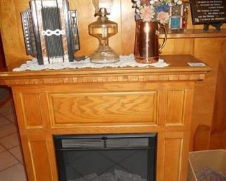 Electric Fireplace, vintage oil lamp, cooper pitcher 
