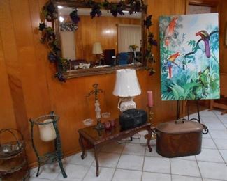 Beveled Mirror, glass top table, lamp, vintage deco scale, cooper container, several candle holders, easel, large cloth bird picture, etc.