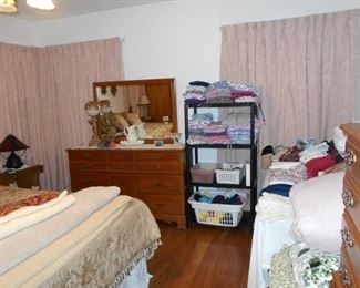 dresser with mirror, clothing, etc.