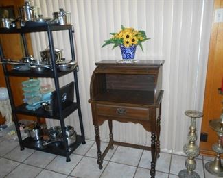 small desk, brass candle holders, pot and pans, Pyrex storage containers 