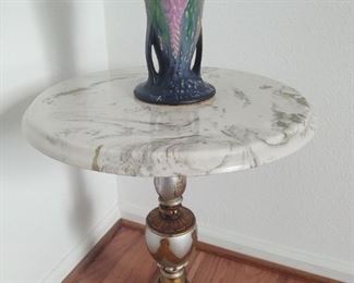 Roseville vase sitting upon green vein marble Mid-Century Renaissance Revival table