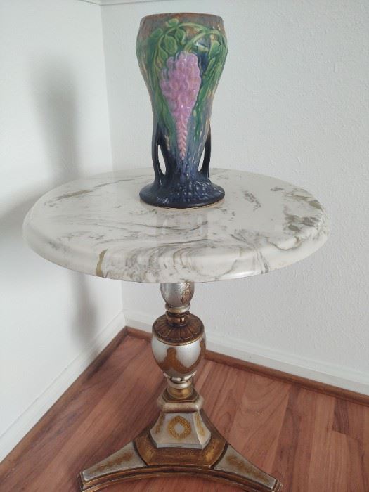 Roseville vase sitting upon green vein marble Mid-Century Renaissance Revival table