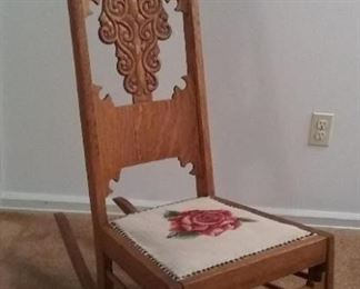 Late 1890s tiger oak rocker with needlepoint seat