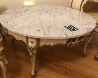 Round marble top table measures 36" diameter and 17" high