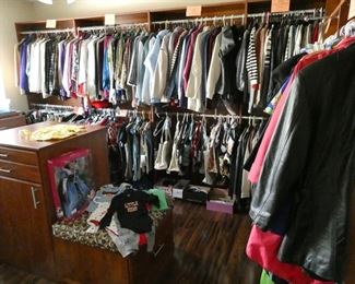 Bedroom converted to ladies closet - jammed packed - most are small size