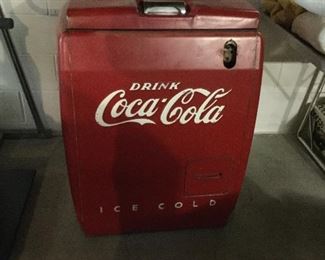 Amazing vintage Coca Cola cooler chest from Smith’s Grocery.  Lift top. Bottle opener in front. Space for wooden case beneath.  Small size is perfect for family room. 