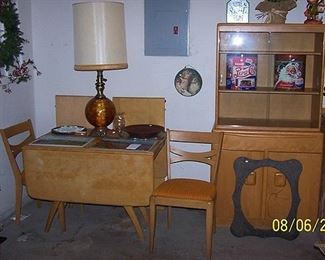 Heywood Wakefield drop leaf table, 2 leaves, 2 chairs and china cabinet. 