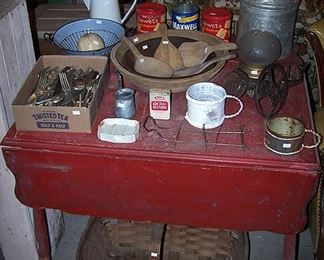 Red paint drop leaf table, butter bowls, paddles, apple peeler, Toledo cream can, etc...
