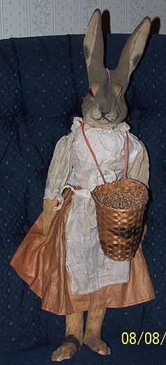 Old composite / paper mache rabbit doll - one glass eye missing, taped foot and crack in head.