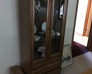 Wooden dining room hutch with glass doors