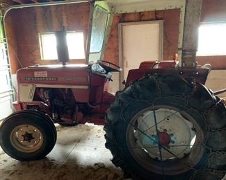 International 464 Farm Tractor.  This comes equipped with a brush hog, a thrasher & a snow blower.