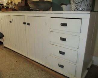 3 doors & 4 drawers it has the same 3 doors & 4 drawers on the on the back side. Would make a great island.