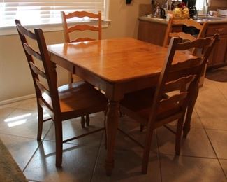 #30 $100.00 Small kitchen table with 4 chairs 1 leaf table 30”h X 42” X 42”  has (1) 18” leaf 