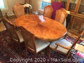 Beautiful Solid Wood Dining room table and 6 Cane Back chairs. 