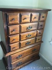 Beautiful tall wooden chest of drawers.